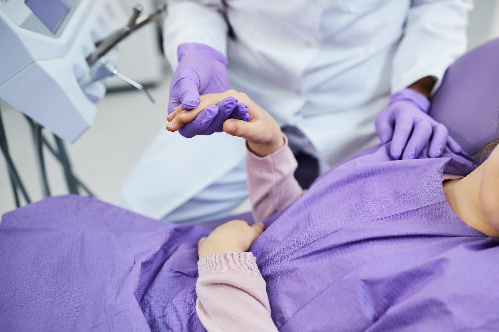 dentist holding patient hand | emergency dentist parramatta vic
