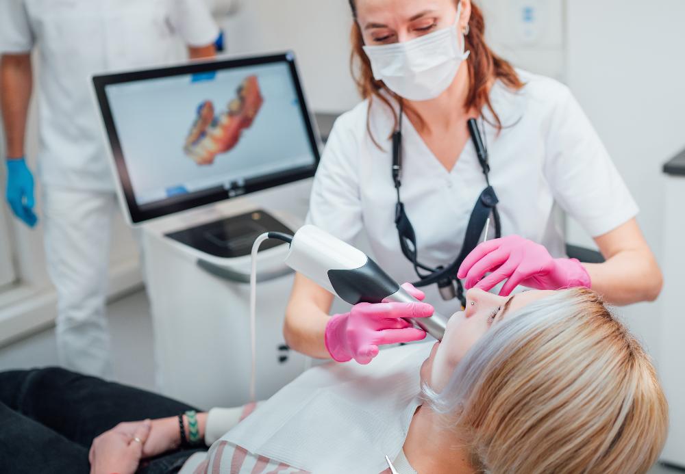 dentist using dental technology with patient | dentist near me