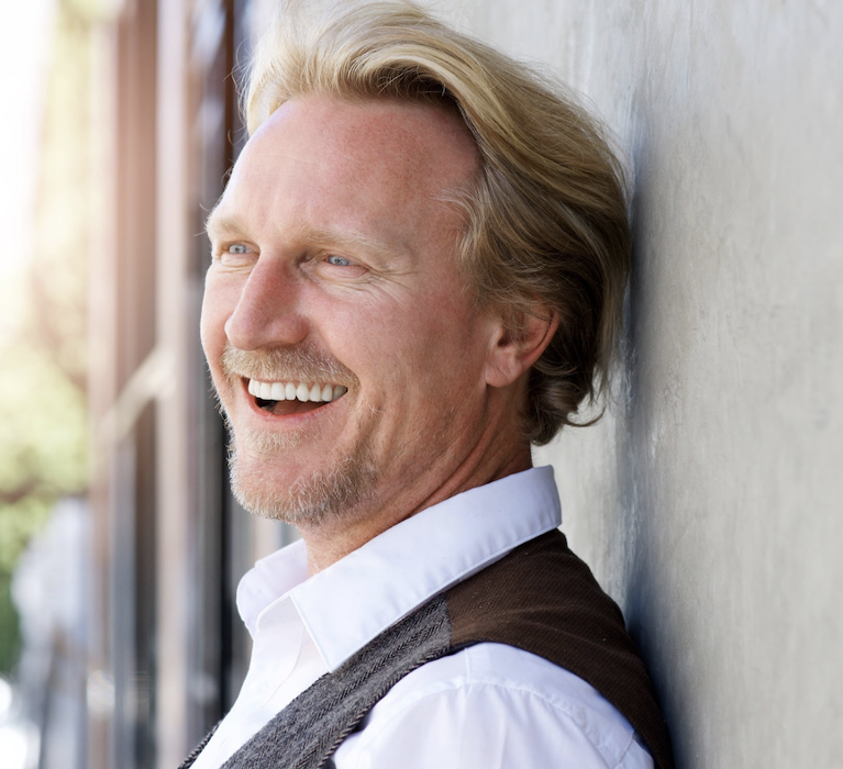 man smiling with all on 4 implant dentures