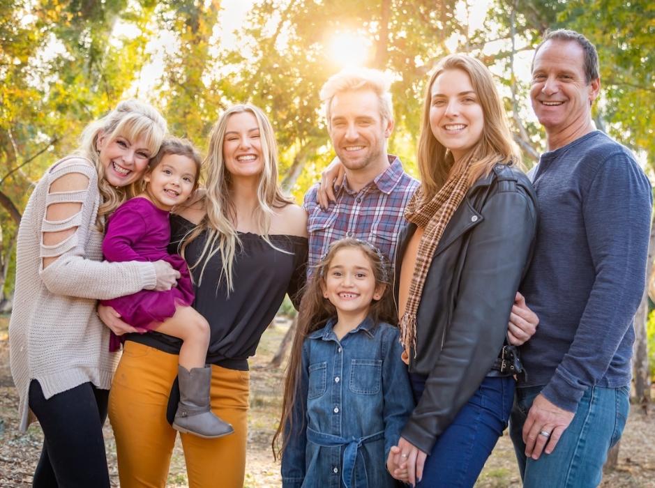same-day dental implant parramatta | family smiling in woods