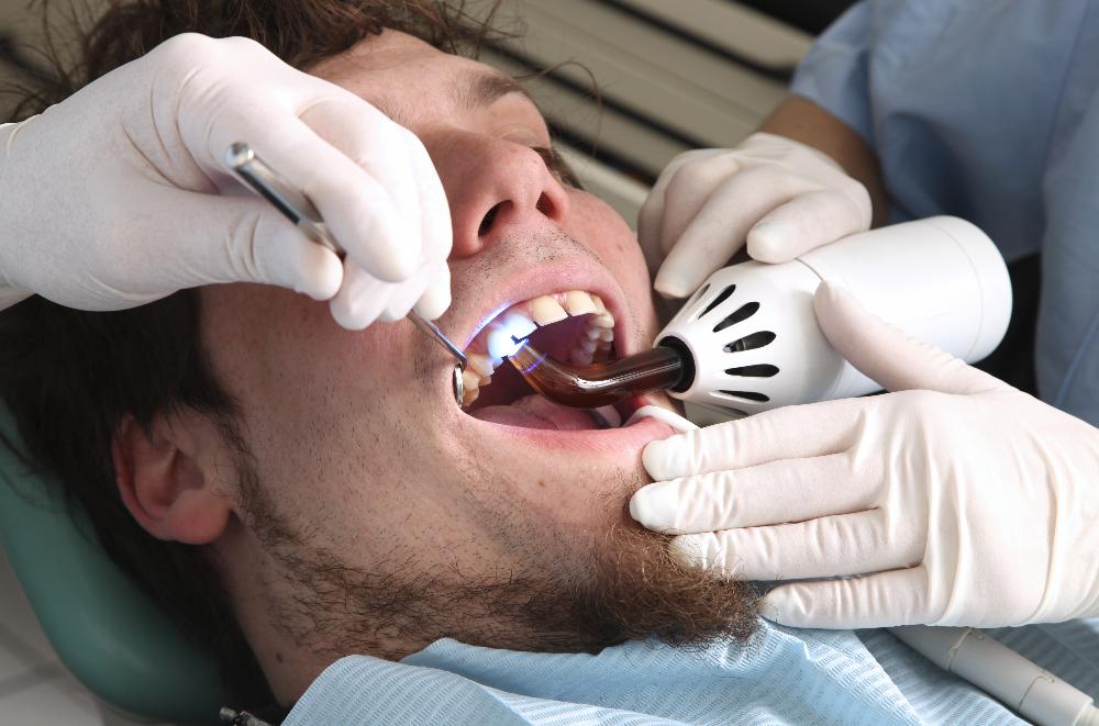 man receiving dental treatment | cosmetic dentist parramatta
