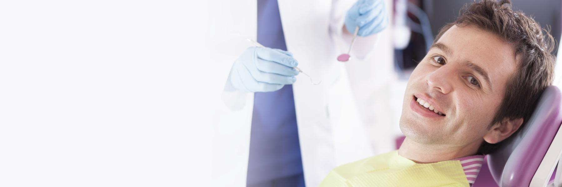 man at dentist for implants in Sydney