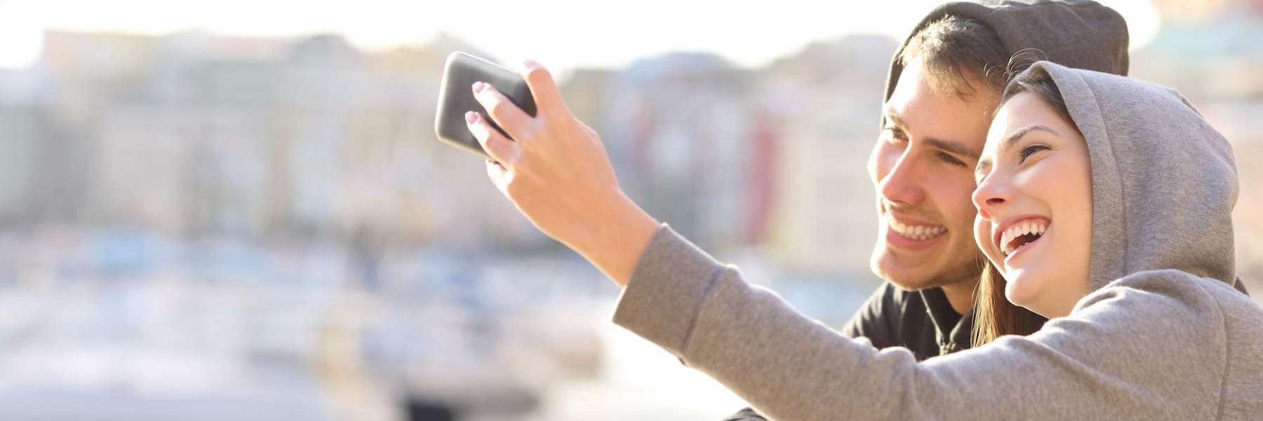 cosmetic dentist parramatta | younger couple taking photo