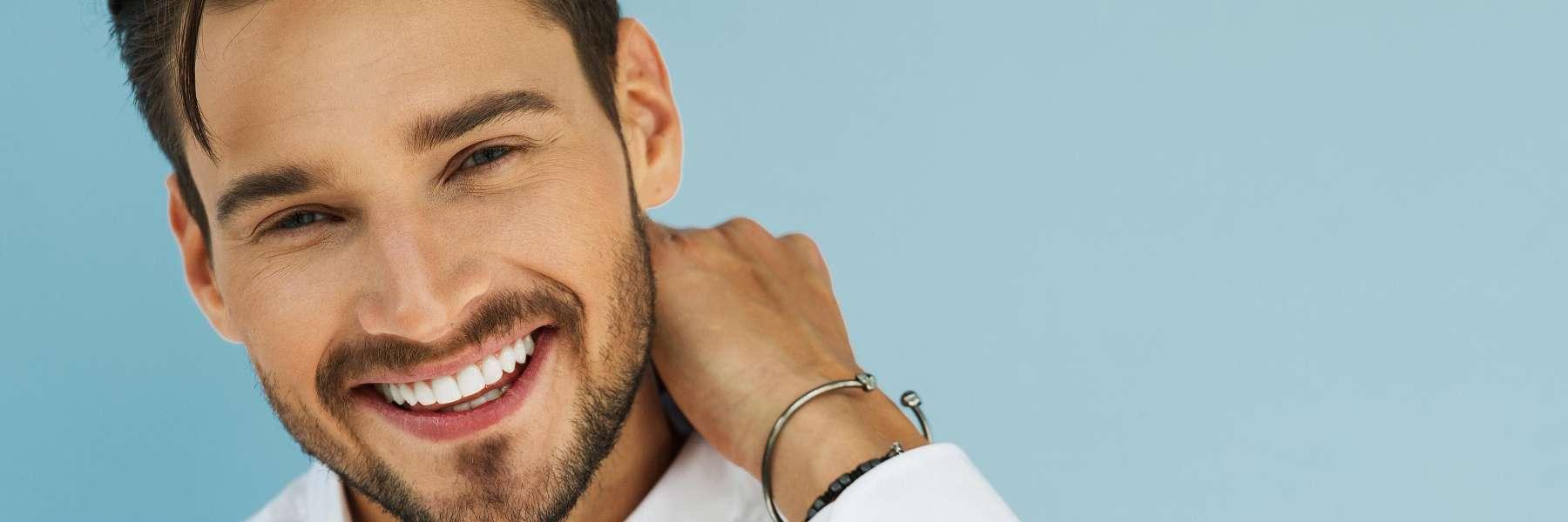 man with silver bracelet smiling | parramatta dentist