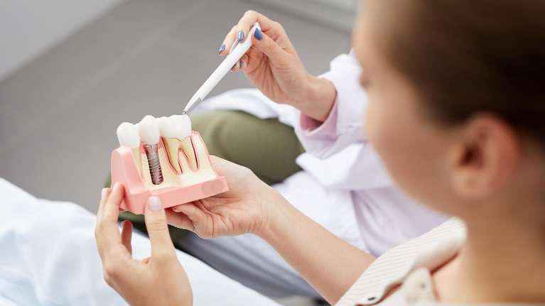 Dr and patient discussing implants | dental implants parramatta