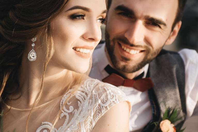 young wedding couple smiling | dental implants parramatta