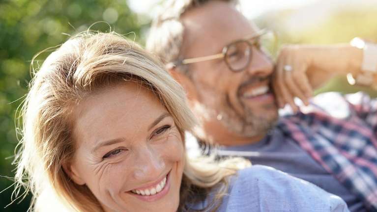 couple laughing outside | dentist parramatta 