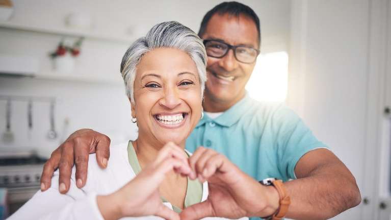 couple discussing tooth replacement solutions in parramatta