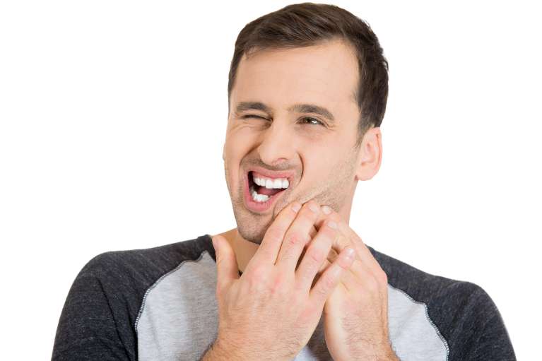 man with toothache from tooth decay