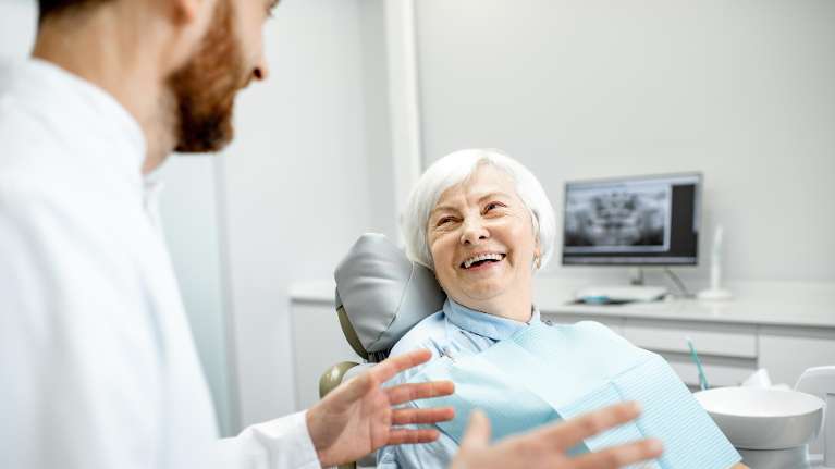 woman with white hair smiling | parramatta dentist
