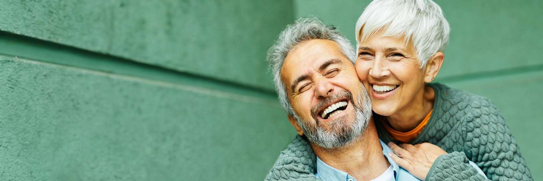couple discussing tooth replacement solutions in parramatta