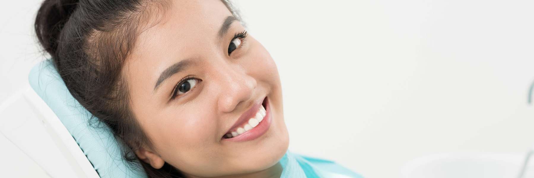Woman at Dentist | Single Tooth Replacement Options