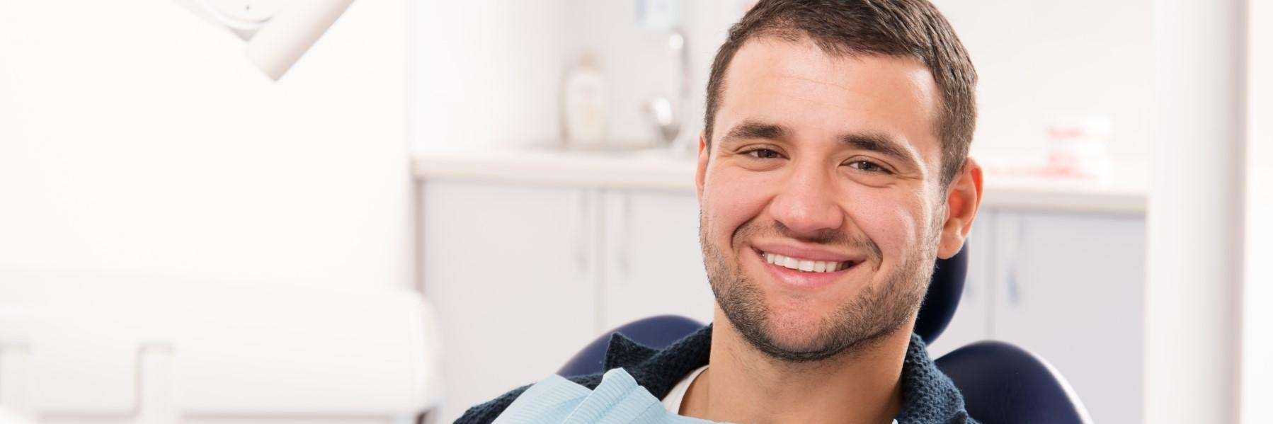 man seeking toothache relief at dentist parramatta