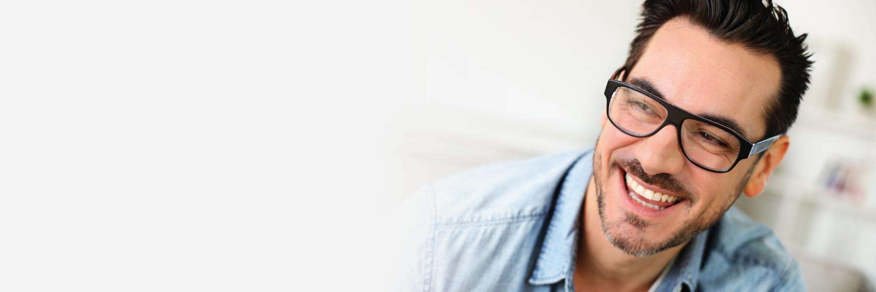man with glasses smiling | dental clinic parramatta